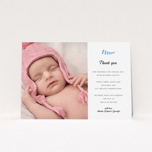 A baptism thank you card template titled "Blue Fern". It is an A6 card in a landscape orientation. It is a photographic baptism thank you card with room for 1 photo. "Blue Fern" is available as a flat card, with tones of white and blue.