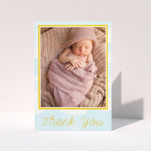 A baptism thank you card design called "Blue Skies". It is an A6 card in a portrait orientation. It is a photographic baptism thank you card with room for 1 photo. "Blue Skies" is available as a folded card, with tones of blue, yellow and white.