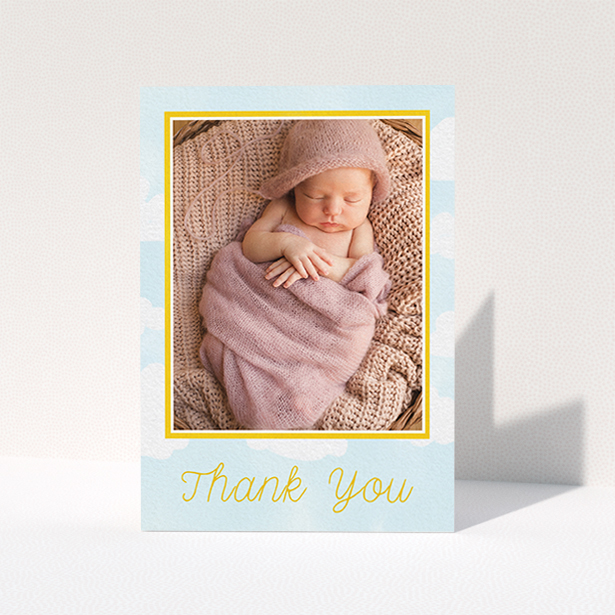 A baptism thank you card design called "Blue Skies". It is an A6 card in a portrait orientation. It is a photographic baptism thank you card with room for 1 photo. "Blue Skies" is available as a folded card, with tones of blue, yellow and white.