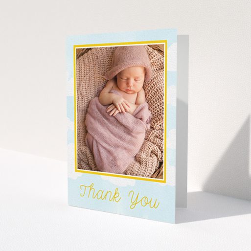 A baptism thank you card design called 'Blue Skies'. It is an A6 card in a portrait orientation. It is a photographic baptism thank you card with room for 1 photo. 'Blue Skies' is available as a folded card, with tones of blue, yellow and white.