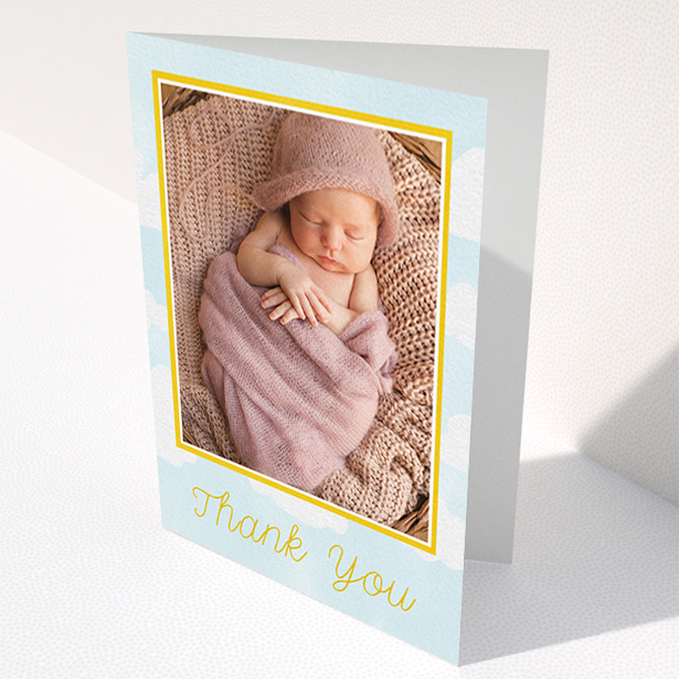 A baptism thank you card design called "Blue Skies". It is an A6 card in a portrait orientation. It is a photographic baptism thank you card with room for 1 photo. "Blue Skies" is available as a folded card, with tones of blue, yellow and white.