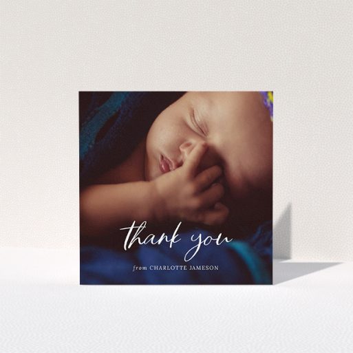 A baptism thank you card template titled "Calligraphy Thanks". It is a square (148mm x 148mm) card in a square orientation. It is a photographic baptism thank you card with room for 1 photo. "Calligraphy Thanks" is available as a folded card, with mainly white colouring.