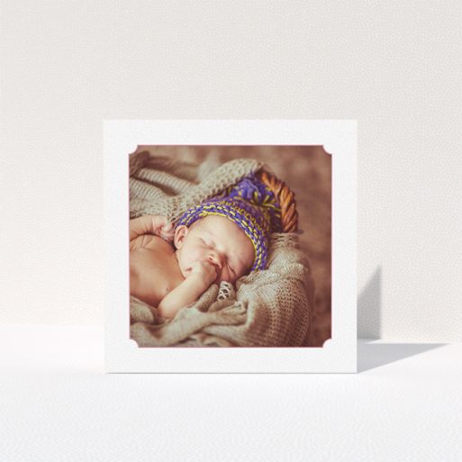 A baptism thank you card design titled "Classic Frame". It is a square (148mm x 148mm) card in a square orientation. It is a photographic baptism thank you card with room for 1 photo. "Classic Frame" is available as a folded card, with tones of white and pink.