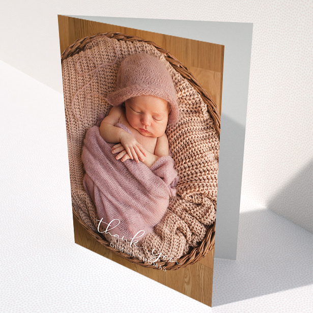 A baptism thank you card template titled "Classic Thank You". It is an A5 card in a portrait orientation. It is a photographic baptism thank you card with room for 1 photo. "Classic Thank You" is available as a folded card, with mainly white colouring.
