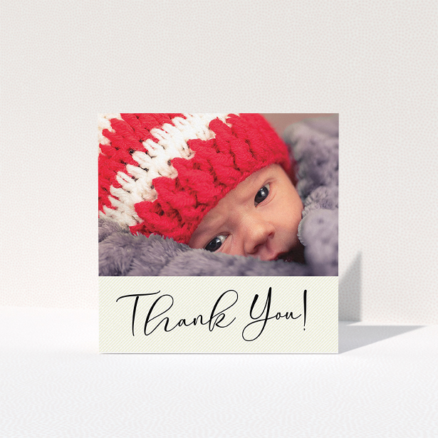 A baptism thank you card design called "Cursive Thanks". It is a square (148mm x 148mm) card in a square orientation. It is a photographic baptism thank you card with room for 1 photo. "Cursive Thanks" is available as a folded card, with mainly cream colouring.