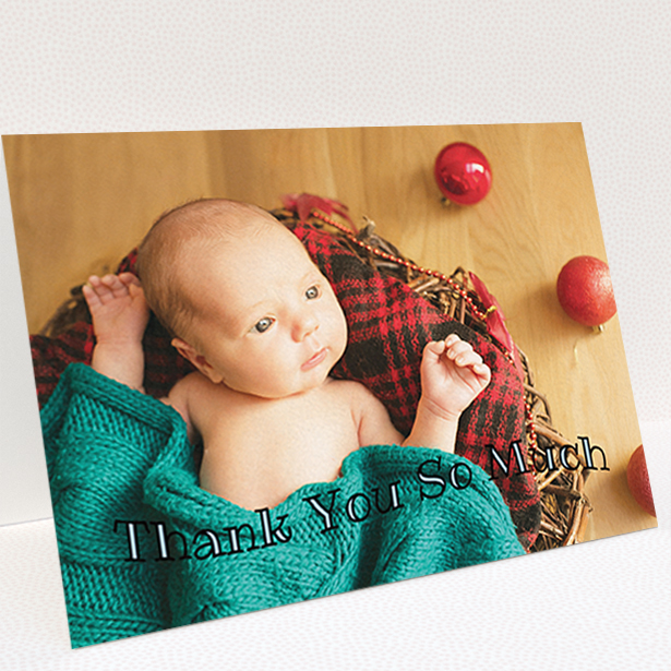 A baptism thank you card template titled "Curvy Thanks". It is an A6 card in a landscape orientation. It is a photographic baptism thank you card with room for 1 photo. "Curvy Thanks" is available as a folded card, with mainly light blue colouring.