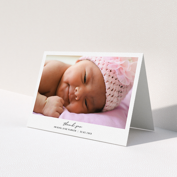 A baptism thank you card design named 'Everything You Need'. It is an A5 card in a landscape orientation. It is a photographic baptism thank you card with room for 1 photo. 'Everything You Need' is available as a folded card, with mainly white colouring.
