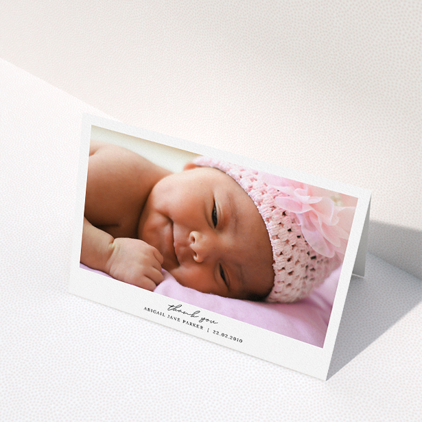 A baptism thank you card design named "Everything You Need". It is an A5 card in a landscape orientation. It is a photographic baptism thank you card with room for 1 photo. "Everything You Need" is available as a folded card, with mainly white colouring.