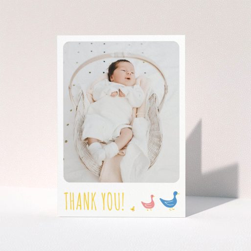 A baptism thank you card called "Family of Ducks". It is an A6 card in a portrait orientation. It is a photographic baptism thank you card with room for 1 photo. "Family of Ducks" is available as a folded card, with tones of yellow, blue and pink.