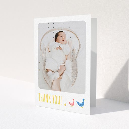 A baptism thank you card called 'Family of Ducks'. It is an A6 card in a portrait orientation. It is a photographic baptism thank you card with room for 1 photo. 'Family of Ducks' is available as a folded card, with tones of yellow, blue and pink.