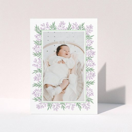 A baptism thank you card design called "Floral Frame". It is an A6 card in a portrait orientation. It is a photographic baptism thank you card with room for 1 photo. "Floral Frame" is available as a folded card, with tones of purple and green.