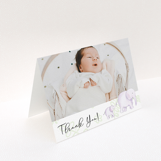 A baptism thank you card called "Gotcha by the Tail". It is an A6 card in a landscape orientation. It is a photographic baptism thank you card with room for 1 photo. "Gotcha by the Tail" is available as a folded card, with tones of purple and green.