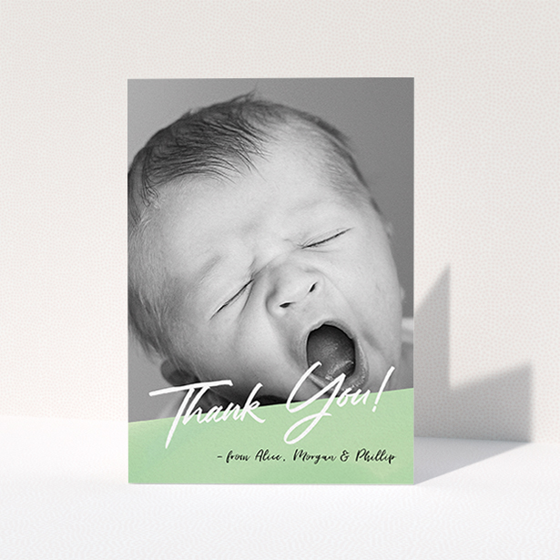 A baptism thank you card design named "Green Slant". It is an A6 card in a portrait orientation. It is a photographic baptism thank you card with room for 1 photo. "Green Slant" is available as a folded card, with tones of green and white.