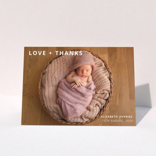 A baptism thank you card named "Love and Thanks Landscape". It is an A5 card in a landscape orientation. It is a photographic baptism thank you card with room for 1 photo. "Love and Thanks Landscape" is available as a folded card, with mainly white colouring.