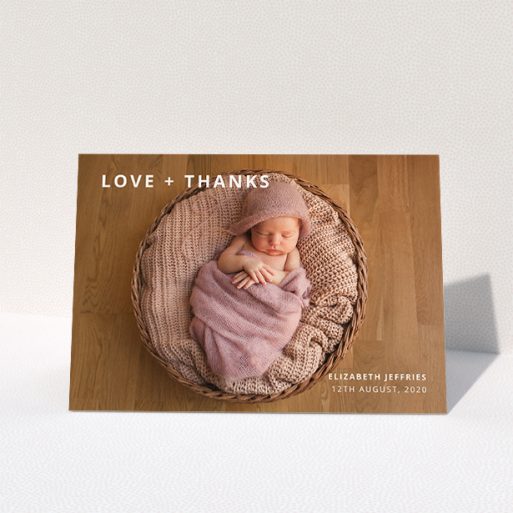 A baptism thank you card named "Love and Thanks Landscape". It is an A5 card in a landscape orientation. It is a photographic baptism thank you card with room for 1 photo. "Love and Thanks Landscape" is available as a folded card, with mainly white colouring.