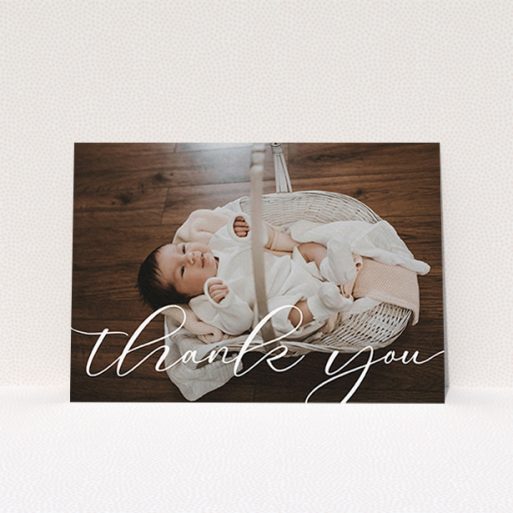 A baptism thank you card design called "One Photo". It is an A6 card in a landscape orientation. It is a photographic baptism thank you card with room for 1 photo. "One Photo" is available as a flat card, with mainly white colouring.