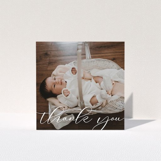 A baptism thank you card named "One Photo". It is a square (148mm x 148mm) card in a square orientation. It is a photographic baptism thank you card with room for 1 photo. "One Photo" is available as a folded card, with mainly white colouring.