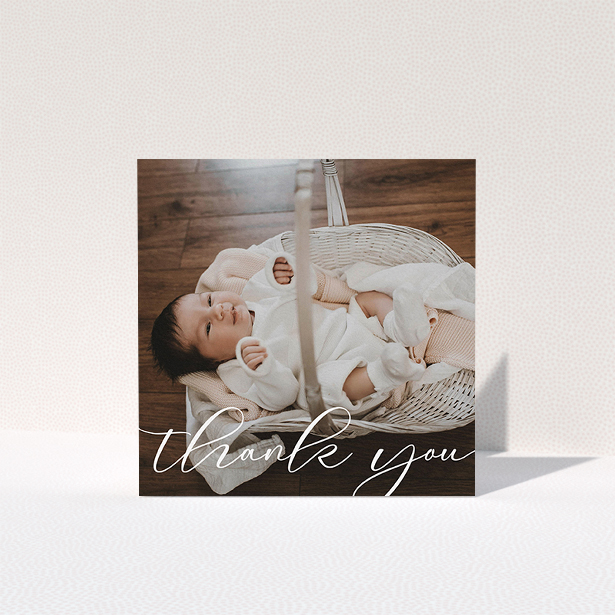 A baptism thank you card named "One Photo". It is a square (148mm x 148mm) card in a square orientation. It is a photographic baptism thank you card with room for 1 photo. "One Photo" is available as a folded card, with mainly white colouring.