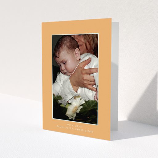 A baptism thank you card called 'Orange and Mint'. It is an A5 card in a portrait orientation. It is a photographic baptism thank you card with room for 1 photo. 'Orange and Mint' is available as a folded card, with tones of orange and blue.