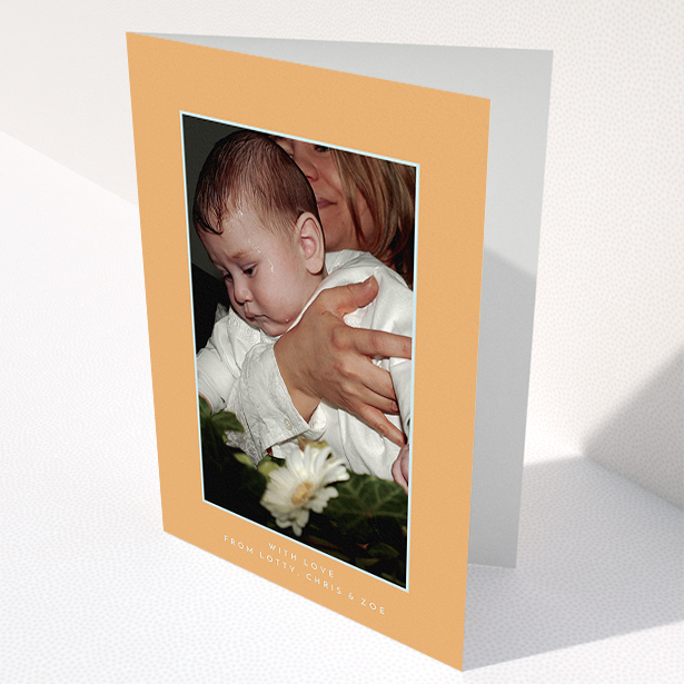 A baptism thank you card called "Orange and Mint". It is an A5 card in a portrait orientation. It is a photographic baptism thank you card with room for 1 photo. "Orange and Mint" is available as a folded card, with tones of orange and blue.