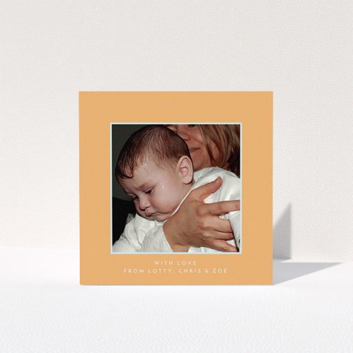 A baptism thank you card template titled "Orange and Mint". It is a square (148mm x 148mm) card in a square orientation. It is a photographic baptism thank you card with room for 1 photo. "Orange and Mint" is available as a folded card, with tones of orange and blue.