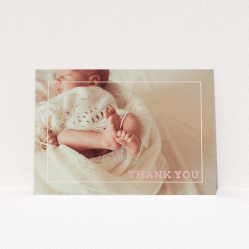 A baptism thank you card called "Over Photo Frame". It is an A5 card in a landscape orientation. It is a photographic baptism thank you card with room for 1 photo. "Over Photo Frame" is available as a flat card, with mainly light pink colouring.