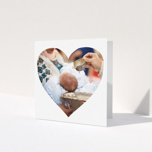 A baptism thank you card design named 'Simple Heart Frames'. It is a square (148mm x 148mm) card in a square orientation. It is a photographic baptism thank you card with room for 1 photo. 'Simple Heart Frames' is available as a folded card, with mainly white colouring.