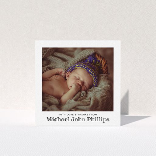 A baptism thank you card template titled "Simple Photo Frame". It is a square (148mm x 148mm) card in a square orientation. It is a photographic baptism thank you card with room for 1 photo. "Simple Photo Frame" is available as a folded card, with mainly white colouring.