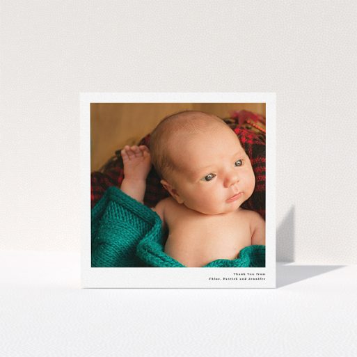 A baptism thank you card design titled "Simple Portrait". It is a square (148mm x 148mm) card in a square orientation. It is a photographic baptism thank you card with room for 1 photo. "Simple Portrait" is available as a folded card, with mainly white colouring.