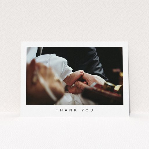A baptism thank you card named "Simple Thanks". It is an A5 card in a landscape orientation. It is a photographic baptism thank you card with room for 1 photo. "Simple Thanks" is available as a flat card, with mainly white colouring.