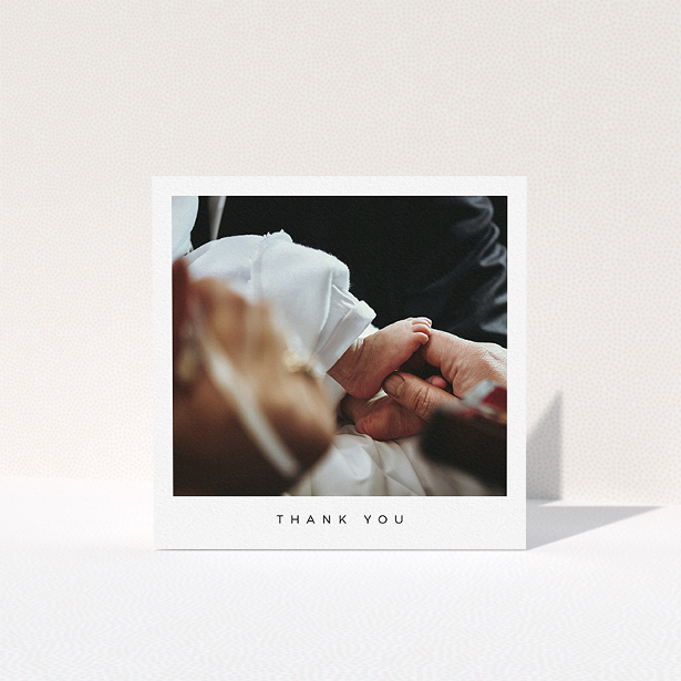 A baptism thank you card named "Simple Thanks". It is a square (148mm x 148mm) card in a square orientation. It is a photographic baptism thank you card with room for 1 photo. "Simple Thanks" is available as a folded card, with mainly white colouring.