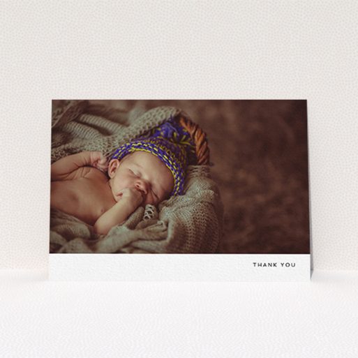 A baptism thank you card design titled "Thankful with Simplicity". It is an A6 card in a landscape orientation. It is a photographic baptism thank you card with room for 1 photo. "Thankful with Simplicity" is available as a flat card, with mainly white colouring.