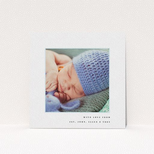 A baptism thank you card design named "Thin Blue Frame". It is a square (148mm x 148mm) card in a square orientation. It is a photographic baptism thank you card with room for 1 photo. "Thin Blue Frame" is available as a flat card, with tones of white and blue.