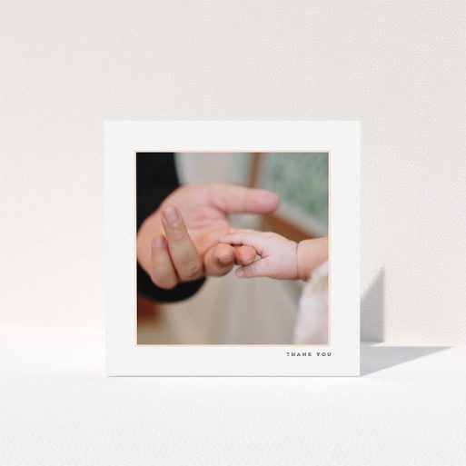 A baptism thank you card named "Thin Pink Frame". It is a square (148mm x 148mm) card in a square orientation. It is a photographic baptism thank you card with room for 1 photo. "Thin Pink Frame" is available as a folded card, with tones of white and pink.