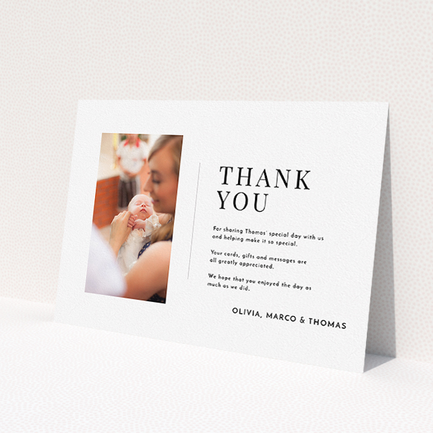 A baptism thank you card template titled "Tiny Portrait". It is an A5 card in a landscape orientation. It is a photographic baptism thank you card with room for 1 photo. "Tiny Portrait" is available as a flat card, with mainly white colouring.