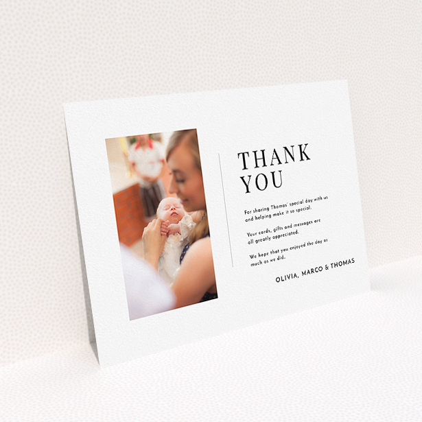 A baptism thank you card template titled "Tiny Portrait". It is an A5 card in a landscape orientation. It is a photographic baptism thank you card with room for 1 photo. "Tiny Portrait" is available as a flat card, with mainly white colouring.