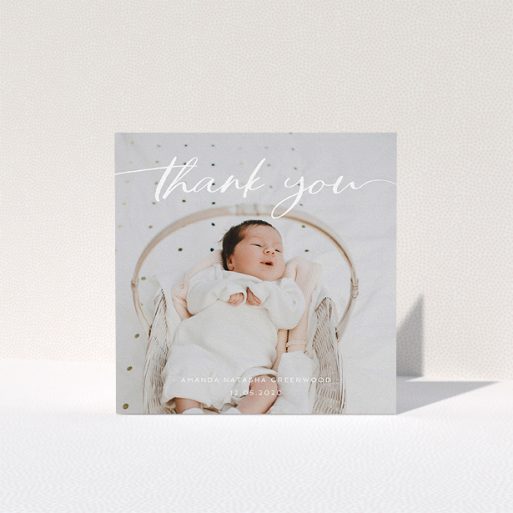 A baptism thank you card design named "Topped and Bottomed". It is a square (148mm x 148mm) card in a square orientation. It is a photographic baptism thank you card with room for 1 photo. "Topped and Bottomed" is available as a folded card, with mainly white colouring.