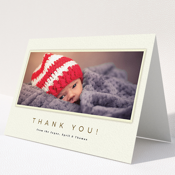 A baptism thank you card design named "Torn Cream Frame". It is an A6 card in a landscape orientation. It is a photographic baptism thank you card with room for 1 photo. "Torn Cream Frame" is available as a folded card, with mainly cream colouring.