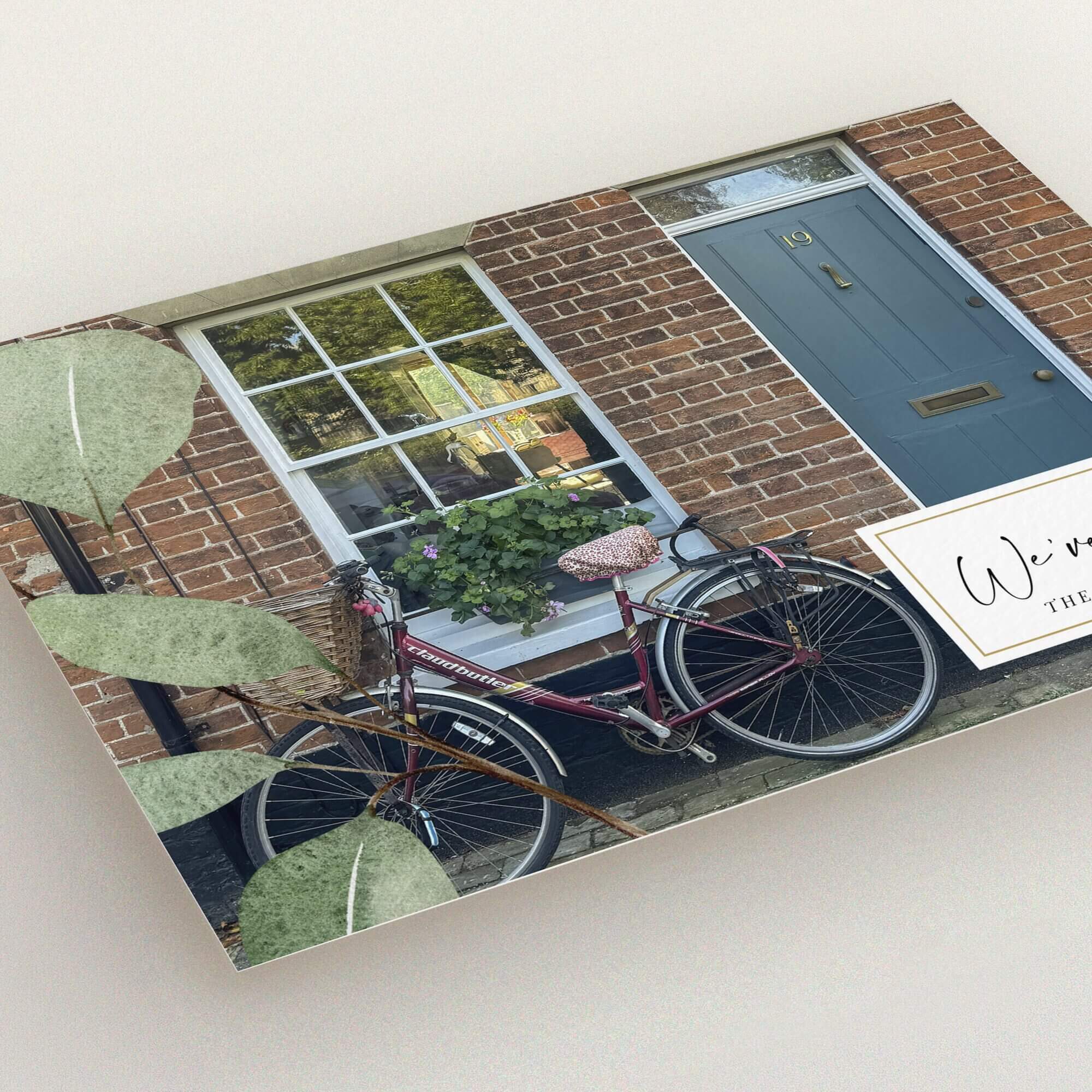 Change of address card with bicycle outside brick house and one photo