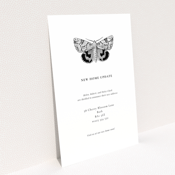 Change of address card with one black and white moth illustration and text.