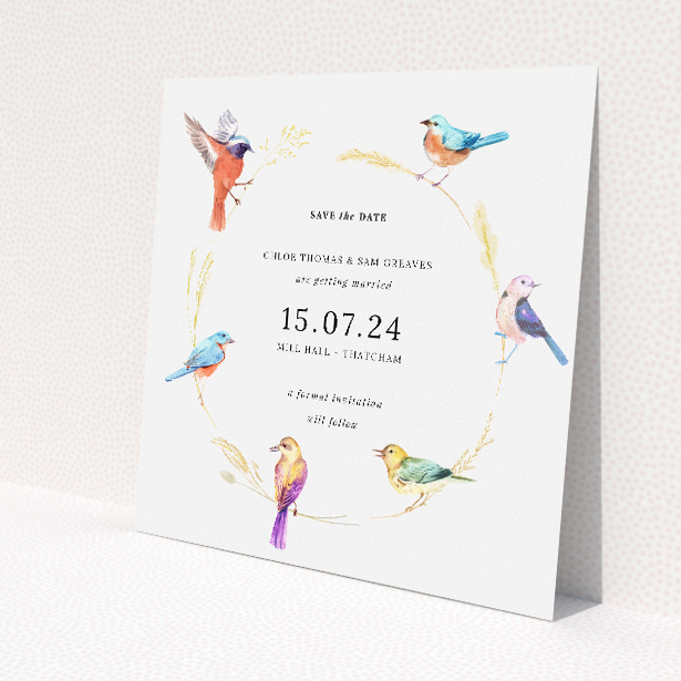Birds and Wreath wedding save the date card featuring exquisite watercolour illustrations of birds within a delicate wreath of golden foliage, perfect for couples who share a love for the outdoors and avian beauty, hinting at a celebration where nature's artistry takes centre stage This is a view of the front