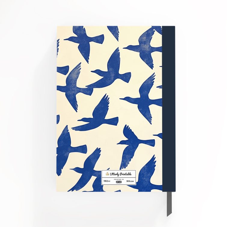 Blue bird-themed notebook cover design with two photos on the back, featuring abstract bird illustrations spreading across the front, spine, and back cover.