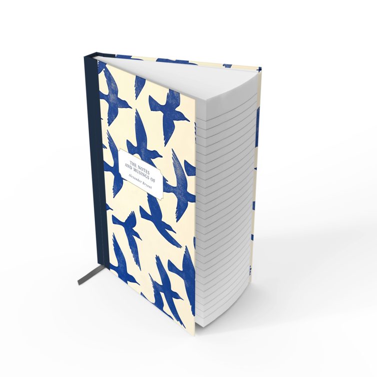 Blue bird-themed notebook cover design with two photos on the back, featuring abstract bird illustrations spreading across the front, spine, and back cover.