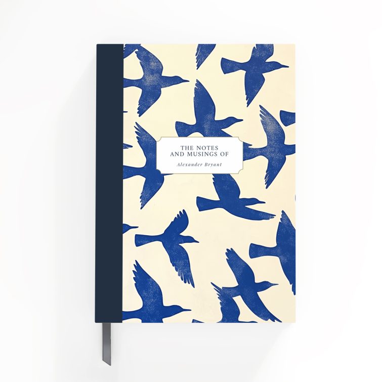 Blue bird-themed notebook cover design with two photos on the back, featuring abstract bird illustrations spreading across the front, spine, and back cover.