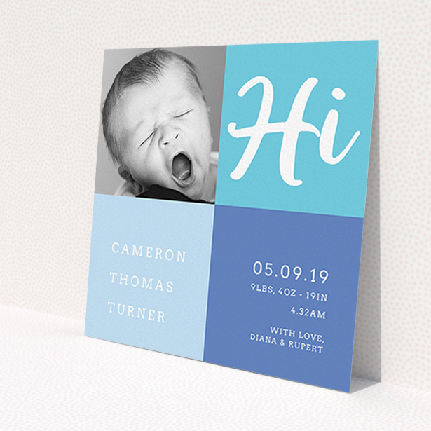 A birth announcement card called 'All Squared Away'. It is a square (148mm x 148mm) card in a square orientation. It is a photographic birth announcement card with room for 1 photo. 'All Squared Away' is available as a flat card, with tones of blue and white.