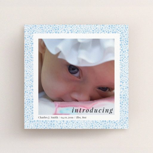A birth announcement card design titled "Baby Blue Floral". It is a square (148mm x 148mm) card in a square orientation. It is a photographic birth announcement card with room for 1 photo. "Baby Blue Floral" is available as a flat card, with tones of blue and white.