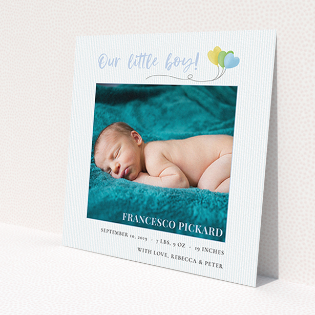 A birth announcement card design titled "Balloooons". It is a square (148mm x 148mm) card in a square orientation. It is a photographic birth announcement card with room for 1 photo. "Balloooons" is available as a flat card, with mainly blue colouring.