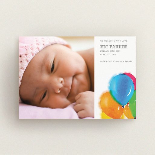 A birth announcement card design titled "Big Balloons". It is an A6 card in a landscape orientation. It is a photographic birth announcement card with room for 1 photo. "Big Balloons" is available as a flat card, with tones of white, orange and blue.