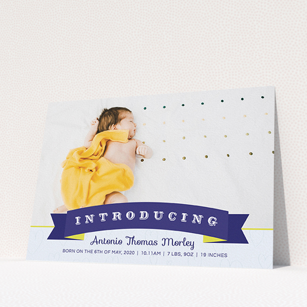 A birth announcement card design titled "Big Banner". It is an A5 card in a landscape orientation. It is a photographic birth announcement card with room for 1 photo. "Big Banner" is available as a flat card, with tones of blue, light blue and yellow.