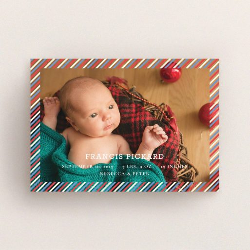 A birth announcement card design titled "Blue, Red and White Slant". It is an A6 card in a landscape orientation. It is a photographic birth announcement card with room for 1 photo. "Blue, Red and White Slant" is available as a flat card, with mainly white colouring.